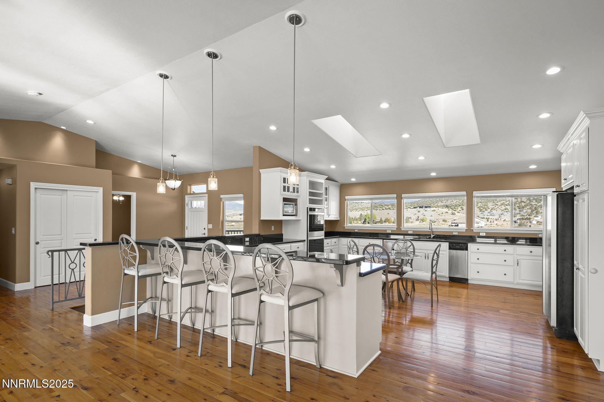 1100 Out-R-Way Gardnerville, NV 89410 - Photo 7 of 30 a room with lots of white furniture and view of kitchen
