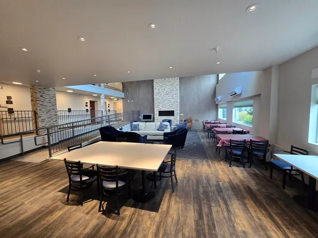 a view of a dining room with furniture window and outside view