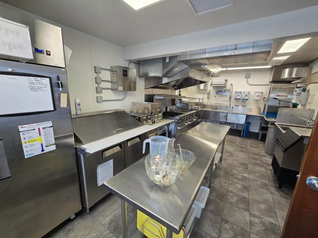 a kitchen with a stove and a cabinet