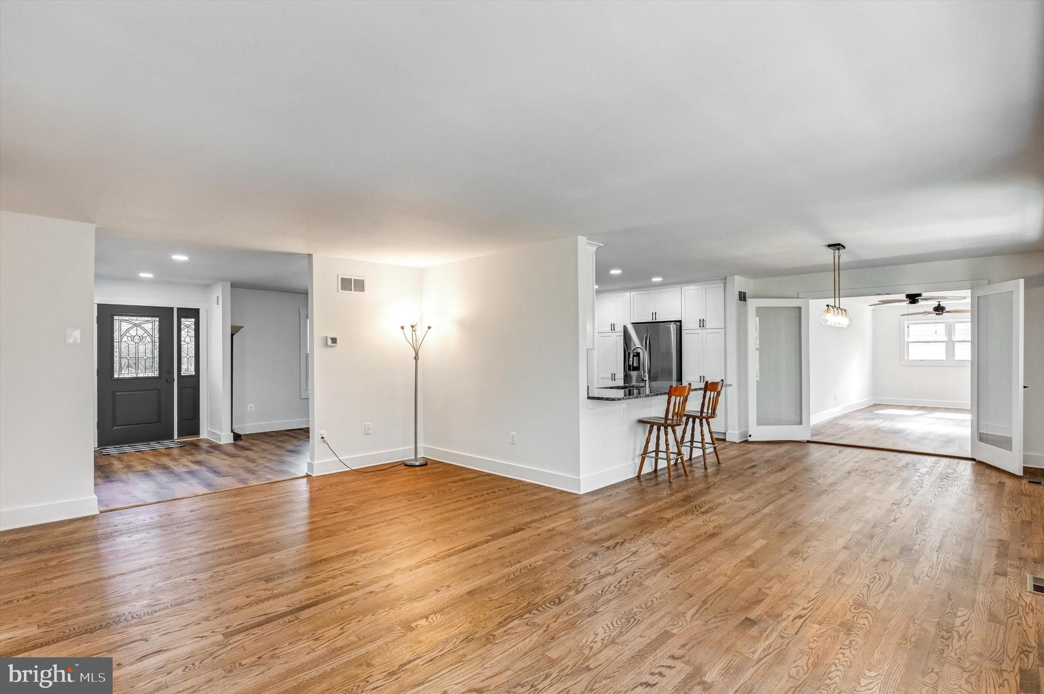 2806 Foxhound Road Ellicott City, MD 21042 - Photo 13 of 55 a view of empty room with wooden floor and a window