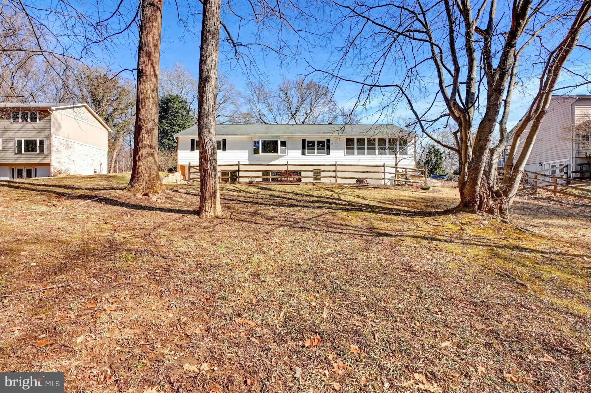 2806 Foxhound Road Ellicott City, MD 21042 - Photo 48 of 55 a front view of a house with a yard