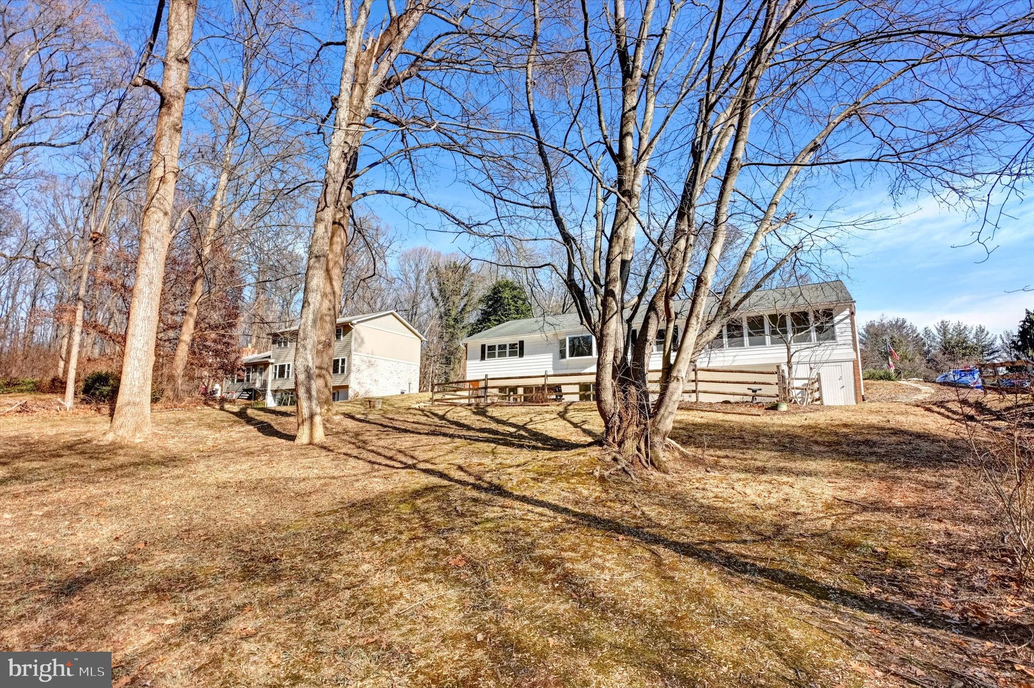 2806 Foxhound Road Ellicott City, MD 21042 - Photo 51 of 55 a white house that has a tree in front of it