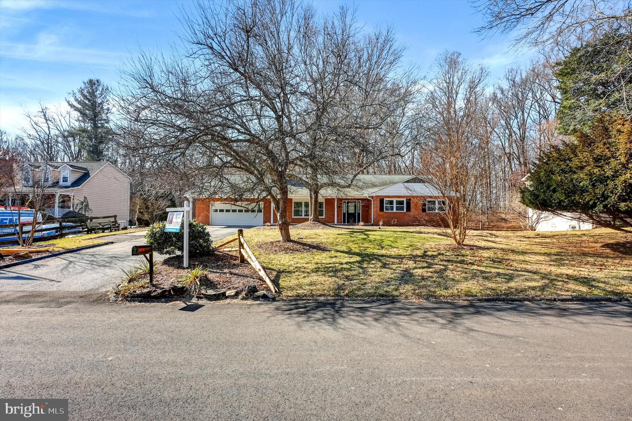 2806 Foxhound Road Ellicott City, MD 21042 - Photo 53 of 55 a front view of a house with a yard