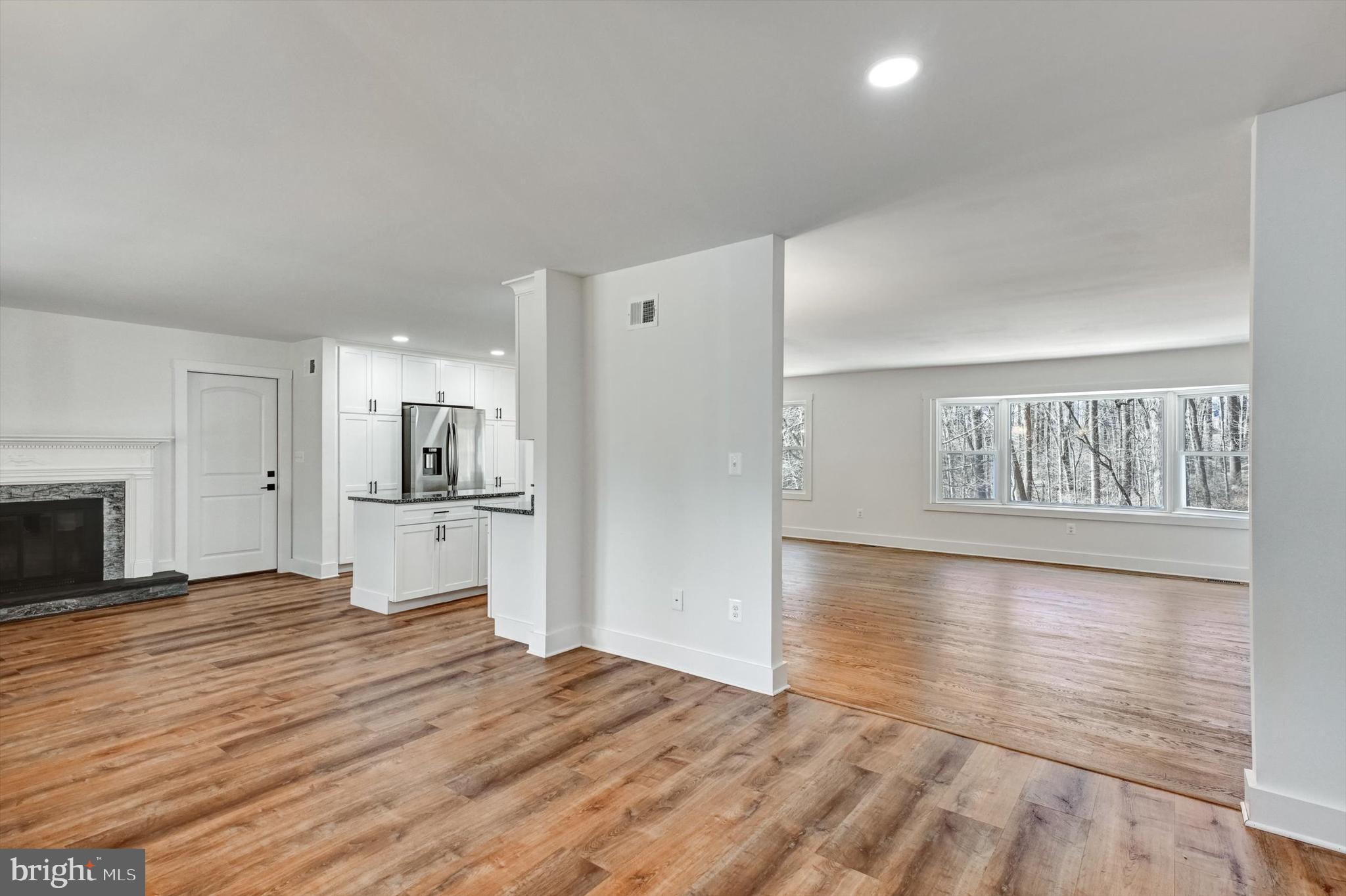 2806 Foxhound Road Ellicott City, MD 21042 - Photo 6 of 55 a view of a kitchen with wooden floor