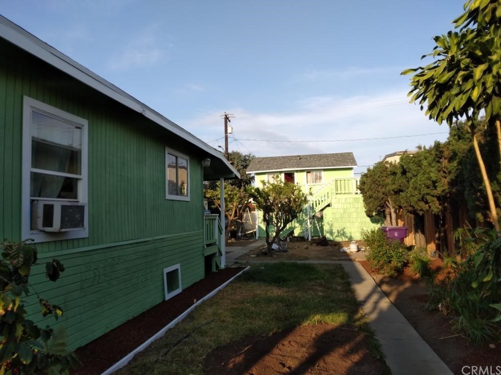 1336 Elm Avenue Long Beach, CA 90813 - Photo 3 of 5 a green field with tree in front of it