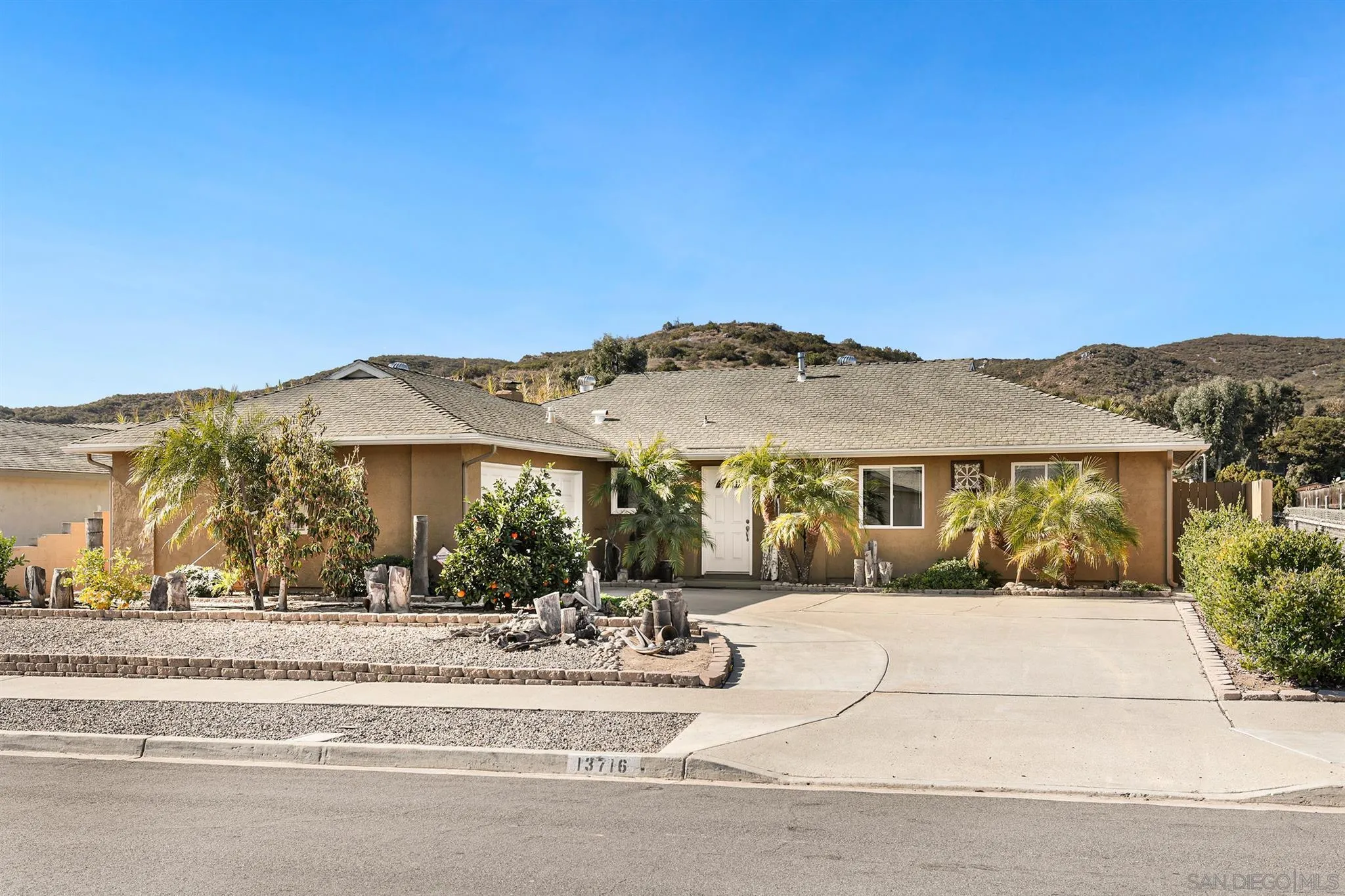 13716 Frame Road Poway, CA 92064 - Photo 1 of 34 front view of a house with a ocean view