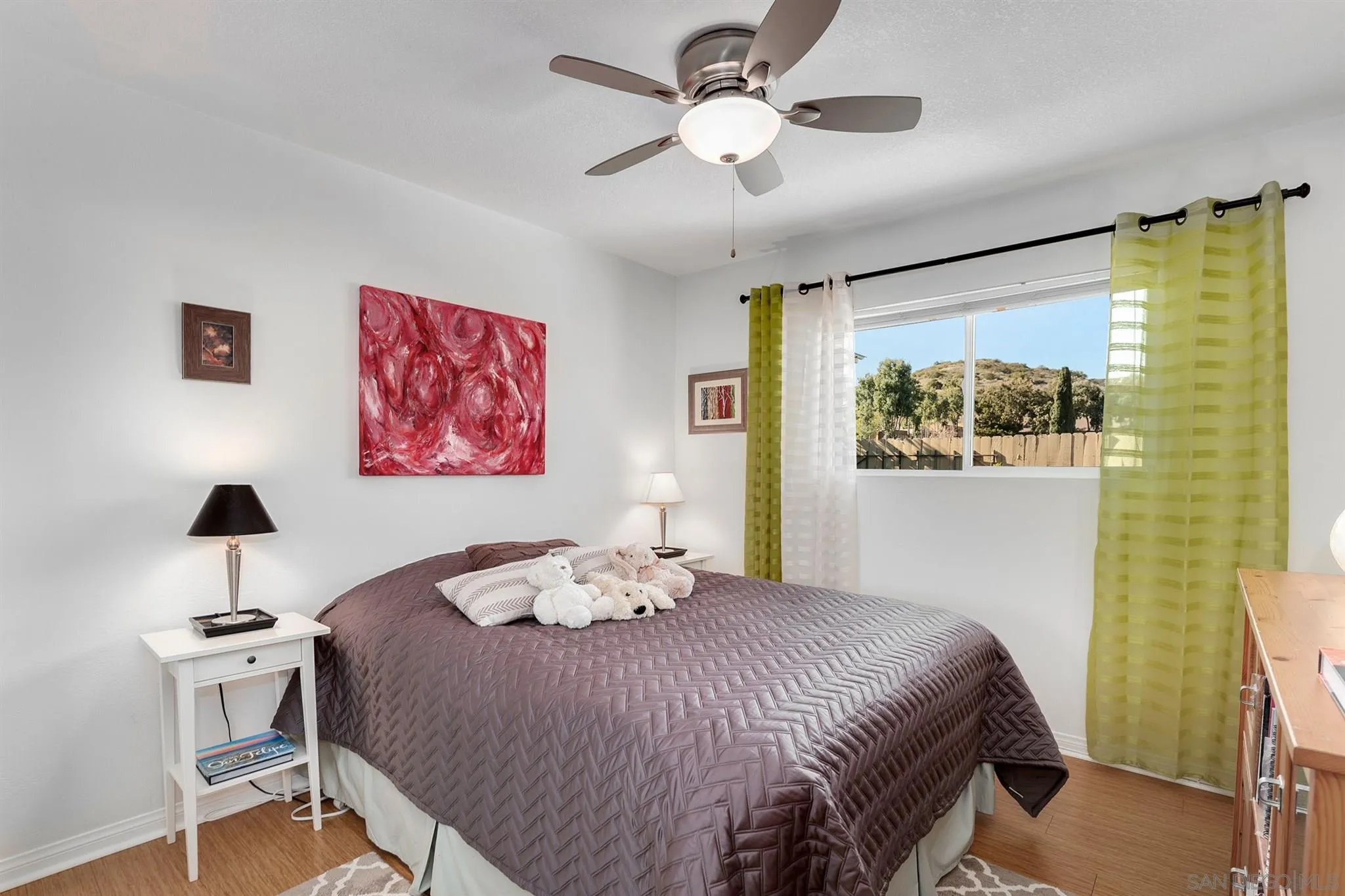 13716 Frame Road Poway, CA 92064 - Photo 15 of 34 a bedroom with a bed and a chandelier