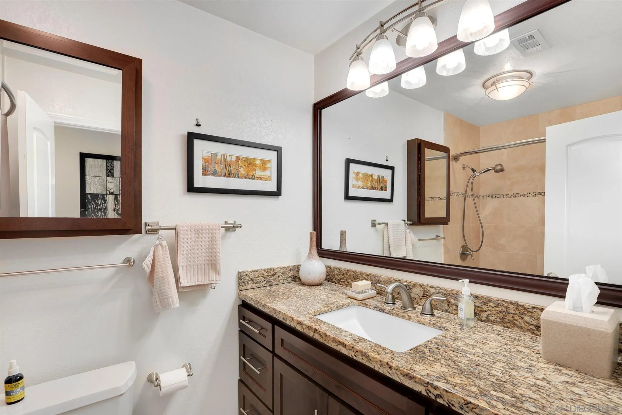 13716 Frame Road Poway, CA 92064 - Photo 16 of 34 a bathroom with a granite countertop double vanity sink and a mirror