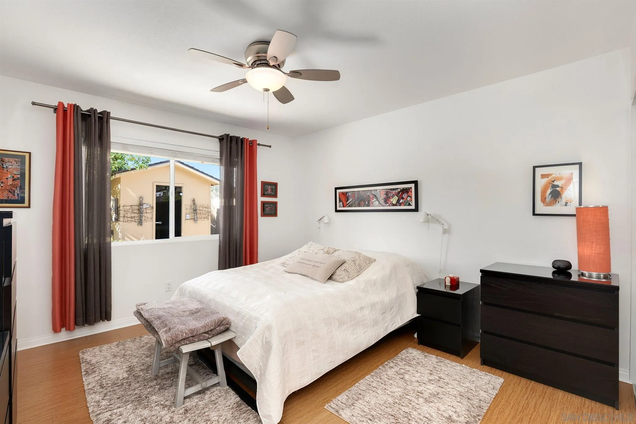 13716 Frame Road Poway, CA 92064 - Photo 19 of 34 a bedroom with a bed and a chandelier