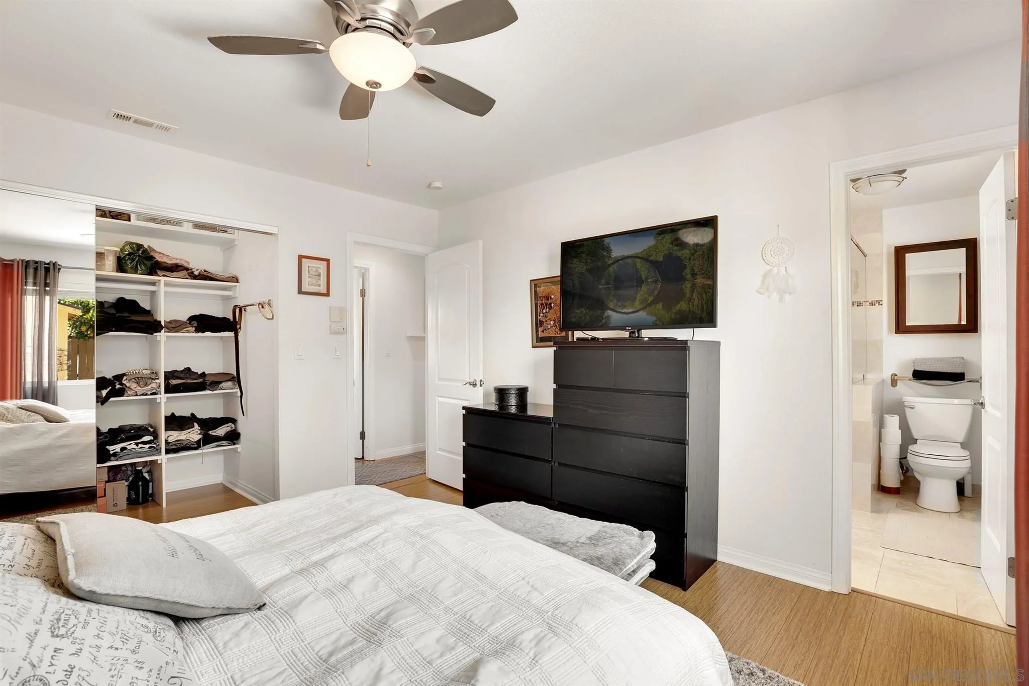 13716 Frame Road Poway, CA 92064 - Photo 20 of 34 a bedroom with a bed and a flat screen tv