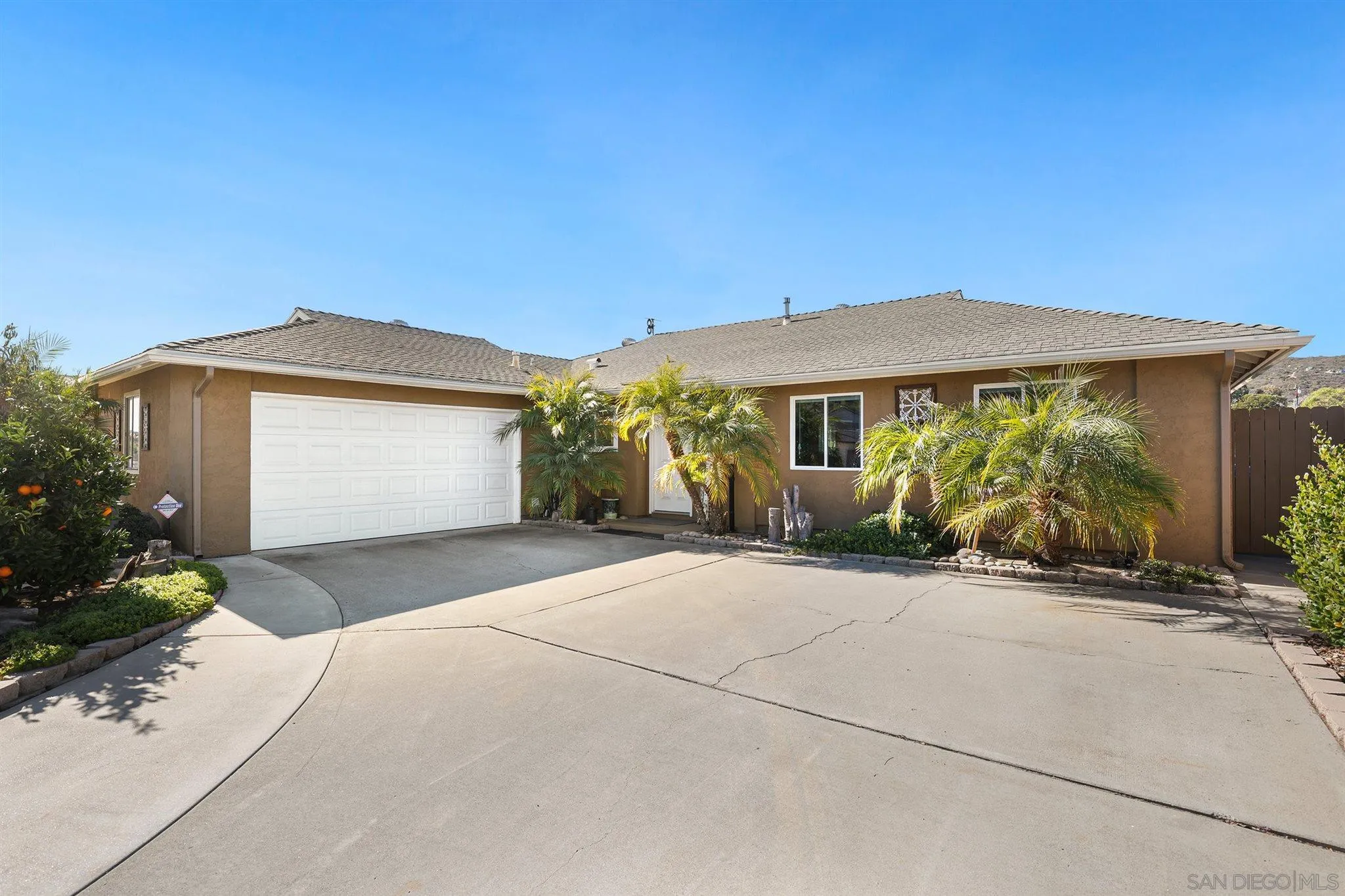 13716 Frame Road Poway, CA 92064 - Photo 2 of 34 a front view of a house with garden