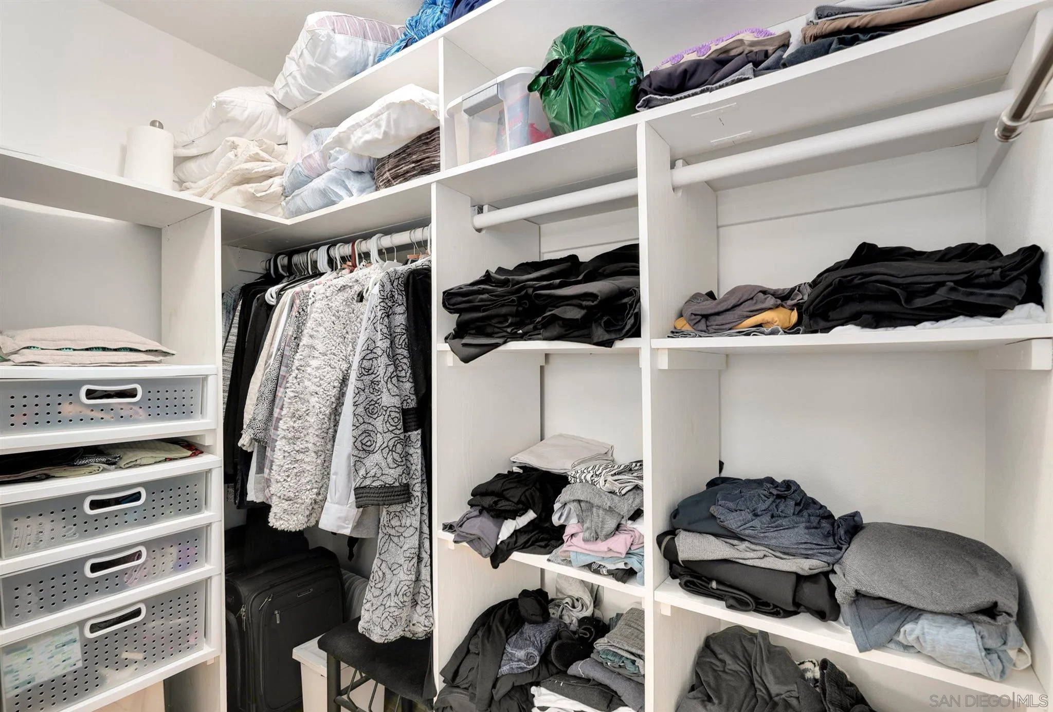 13716 Frame Road Poway, CA 92064 - Photo 21 of 34 a view of walk in closet with clothes and shoes