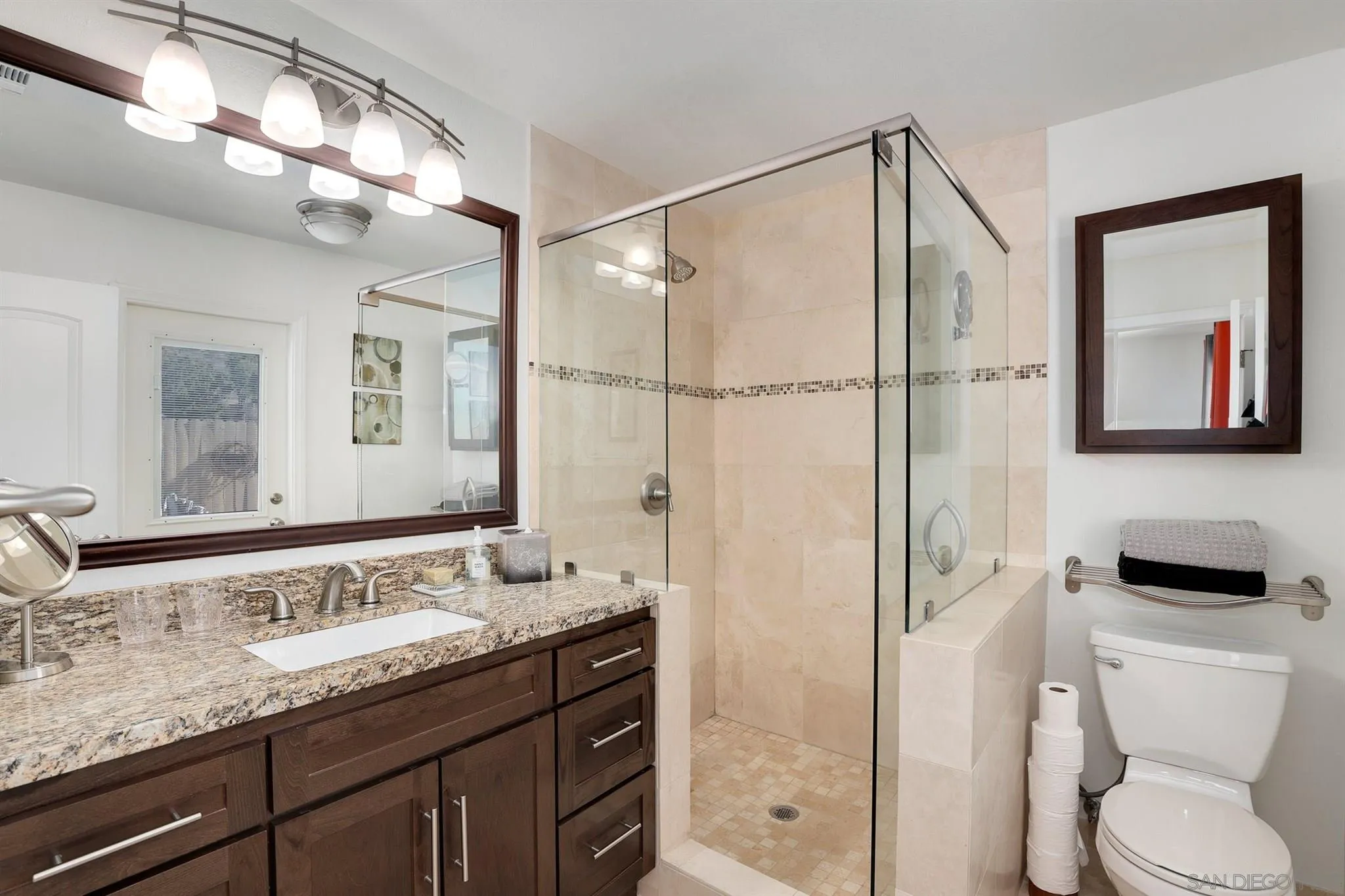 13716 Frame Road Poway, CA 92064 - Photo 22 of 34 a bathroom with a granite countertop sink toilet and shower