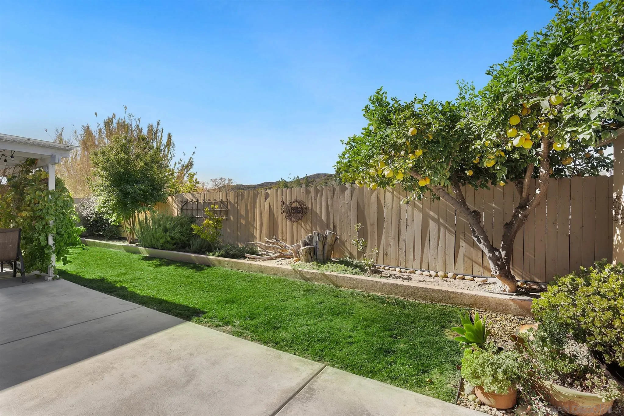 13716 Frame Road Poway, CA 92064 - Photo 27 of 34 a view of outdoor space with garden and wooden fence