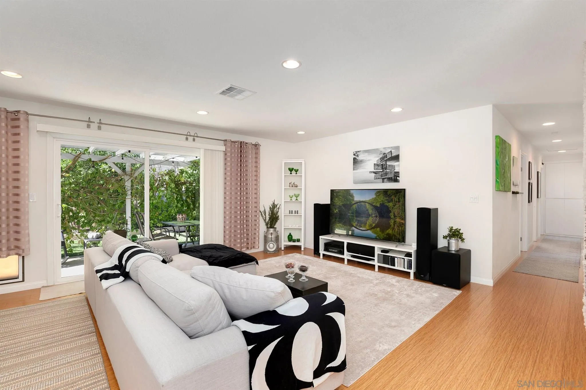13716 Frame Road Poway, CA 92064 - Photo 3 of 34 a living room with furniture tv and large windows