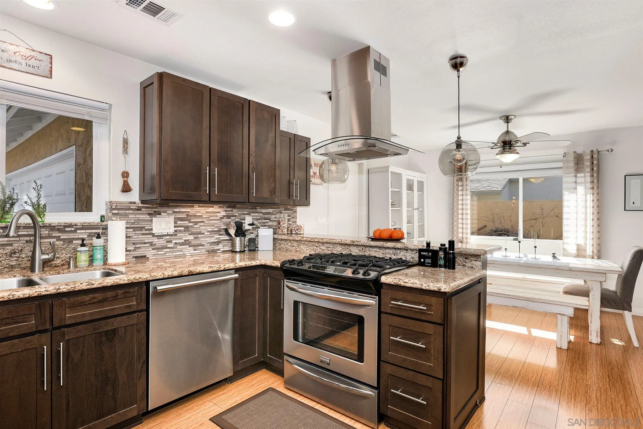 13716 Frame Road Poway, CA 92064 - Photo 9 of 34 a kitchen with a sink stove and cabinets