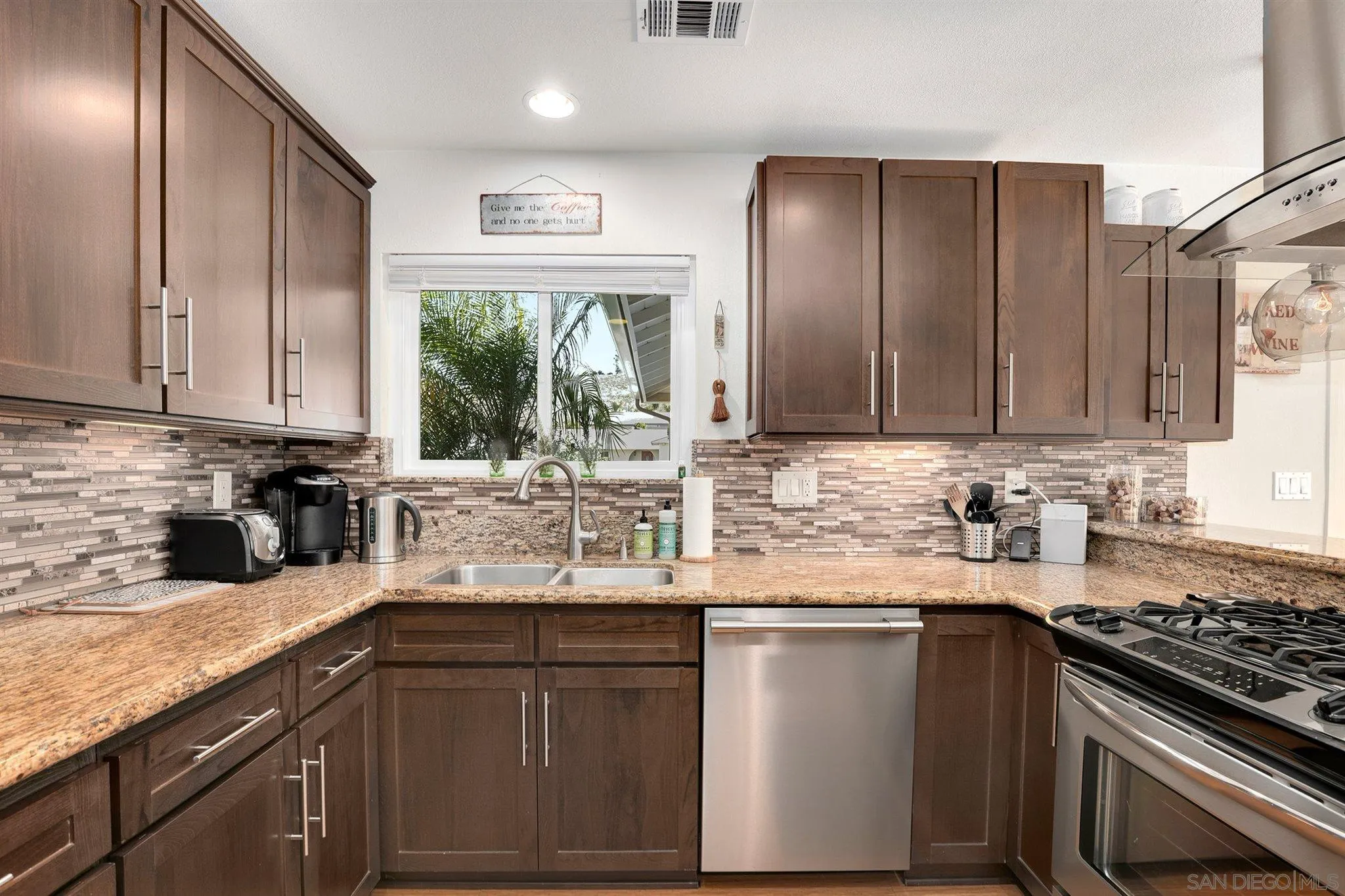 13716 Frame Road Poway, CA 92064 - Photo 10 of 34 a kitchen with stainless steel appliances granite countertop a sink stove and cabinets