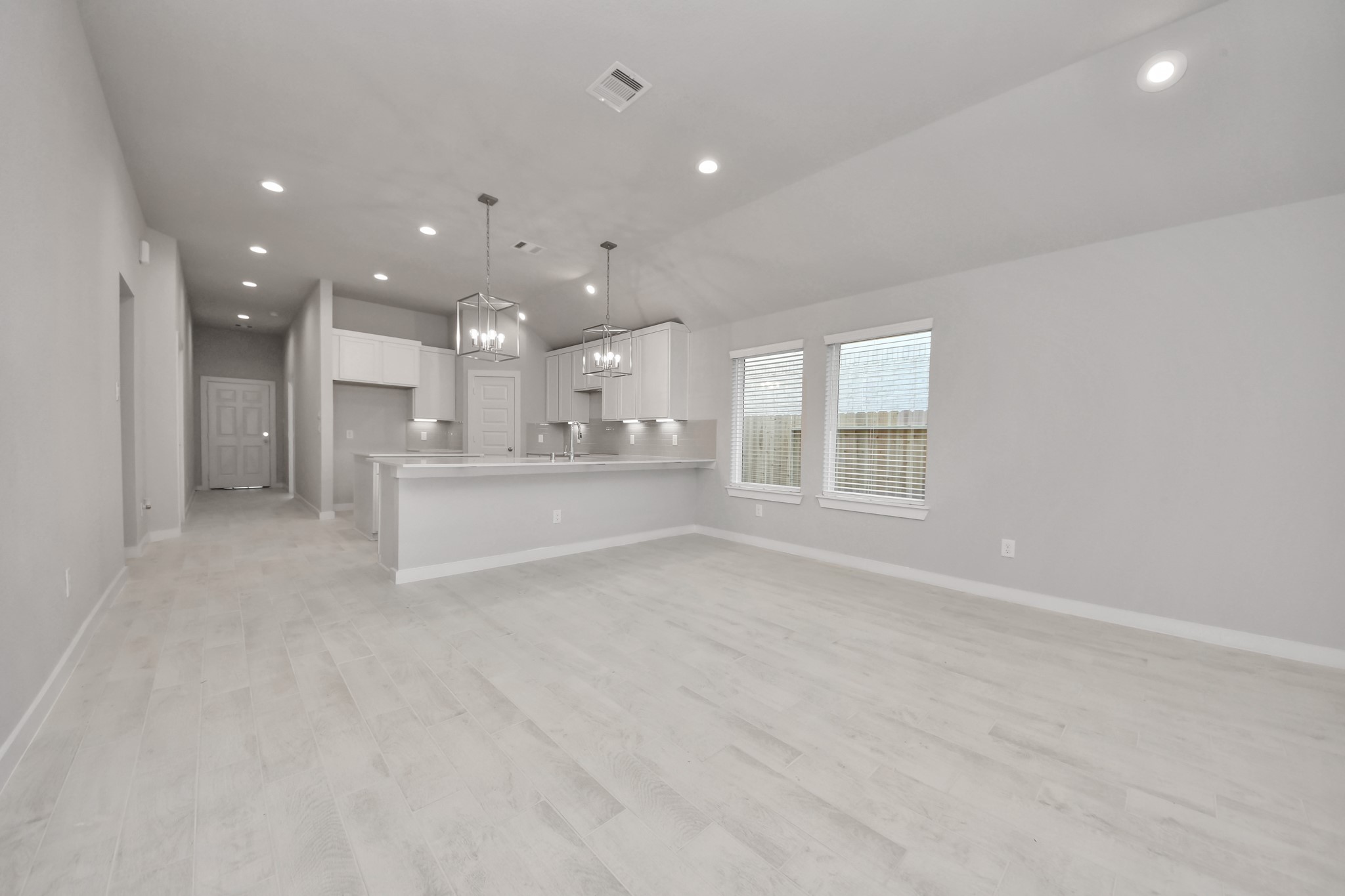 311 Ice Shr Trail Dayton, TX 77535 - Photo 21 of 35 Take another glimpse into the heart of the home with this additional view of the family room—a sprawling space ready to accommodate all your gatherings. Sample photo of completed home with similar floor plan. Actual colors and selections may vary.