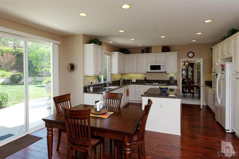 287 Knoll Ridge Road Simi Valley, CA 93065 - Photo 17 of 36 a view of a dining room with furniture window and wooden floor