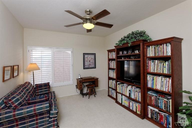 287 Knoll Ridge Road Simi Valley, CA 93065 - Photo 21 of 36 a living room with bookshelf and a flat screen tv