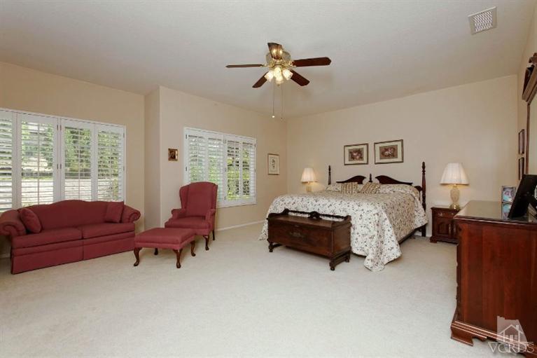 287 Knoll Ridge Road Simi Valley, CA 93065 - Photo 25 of 36 a living room with furniture ceiling fan and a window