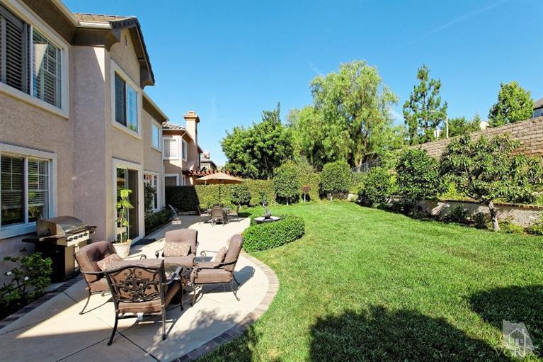 287 Knoll Ridge Road Simi Valley, CA 93065 - Photo 36 of 36 a view of backyard of house with outdoor seating and green space