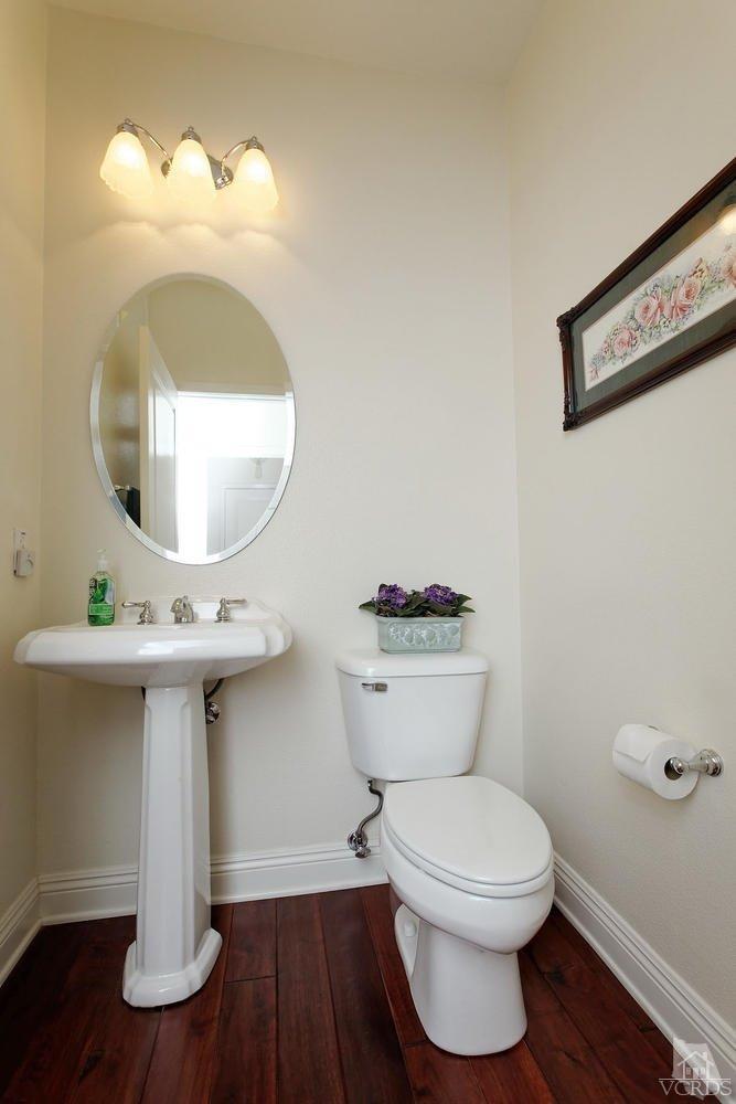 287 Knoll Ridge Road Simi Valley, CA 93065 - Photo 9 of 36 a bathroom with a sink mirror and toilet