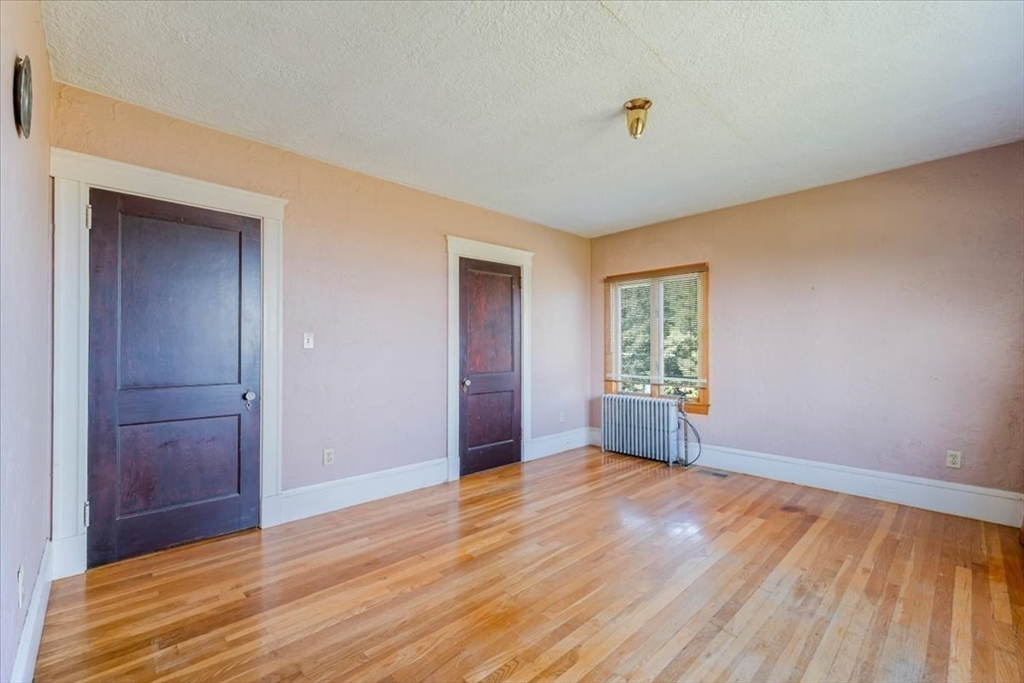 70 Hedge Road Plymouth, MA 02360 - Photo 24 of 41 wooden floor in an empty room with a window