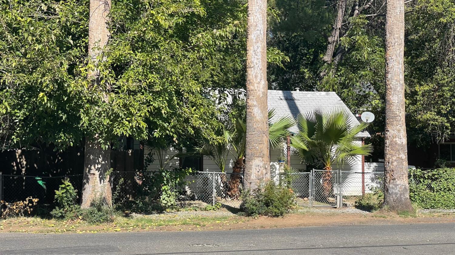 1244 West 3rd Street Chico, CA 95928 - Photo 3 of 7 front view of a house with a tree