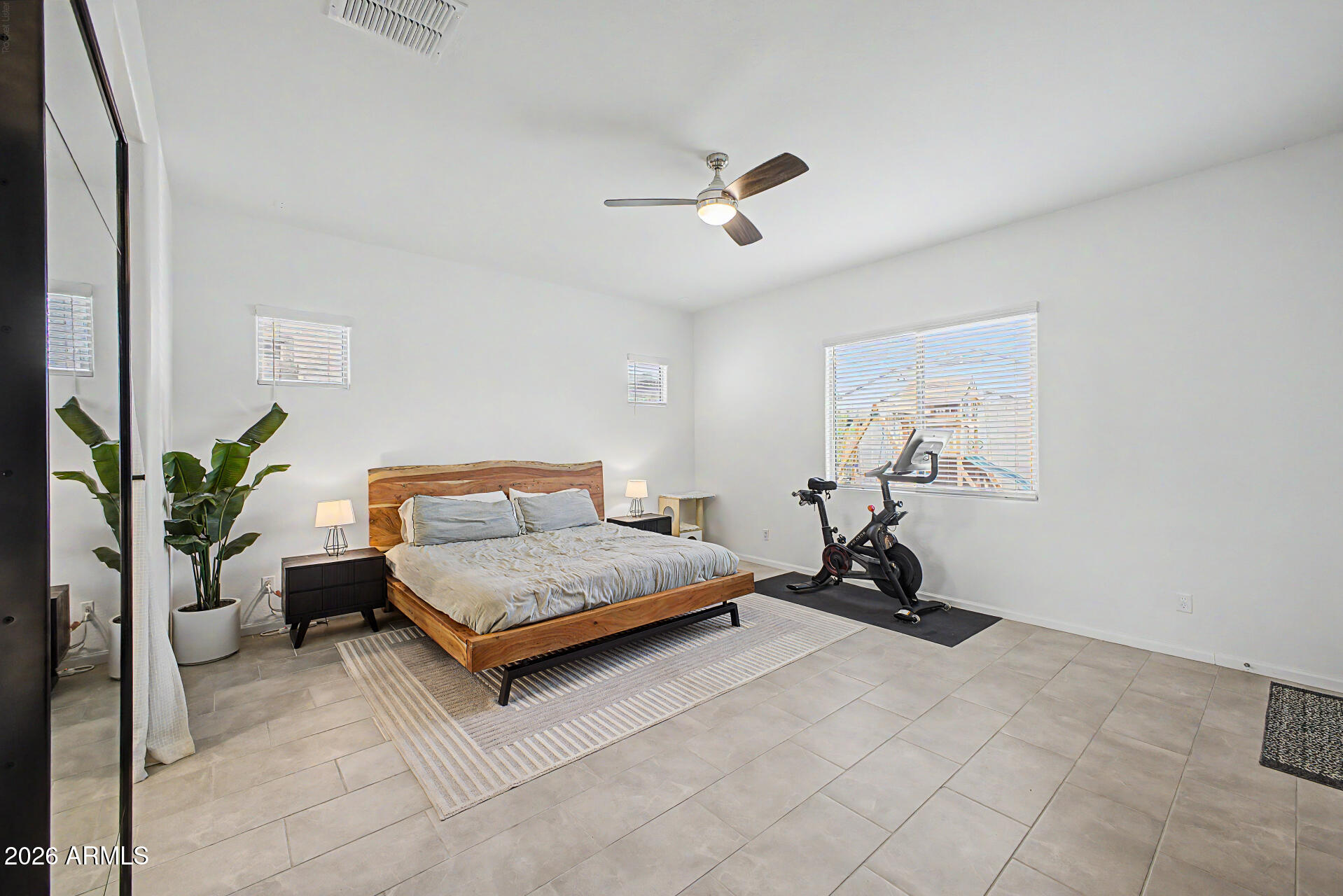 6511 West Steed Ridge Phoenix, AZ 85083 - Photo 14 of 41 a living room with furniture gym equipment and a potted plant