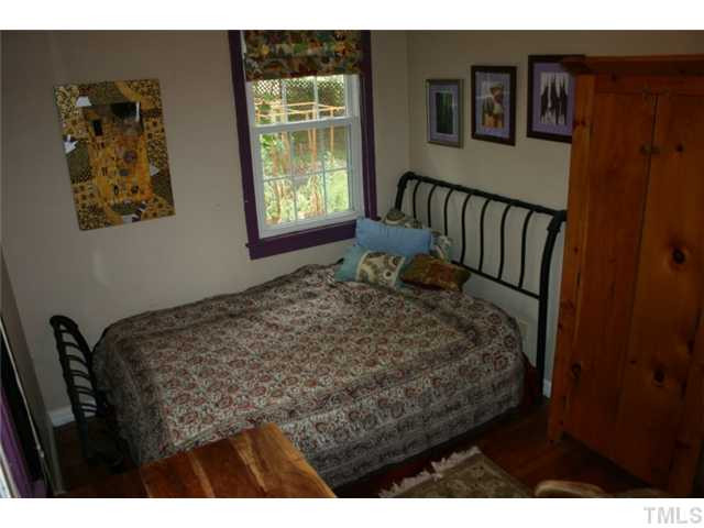 2104 Ruffin Street Durham, NC 27704 - Photo 11 of 18 Bedroom 2 has a view of the garden in the back yard. Bedroom