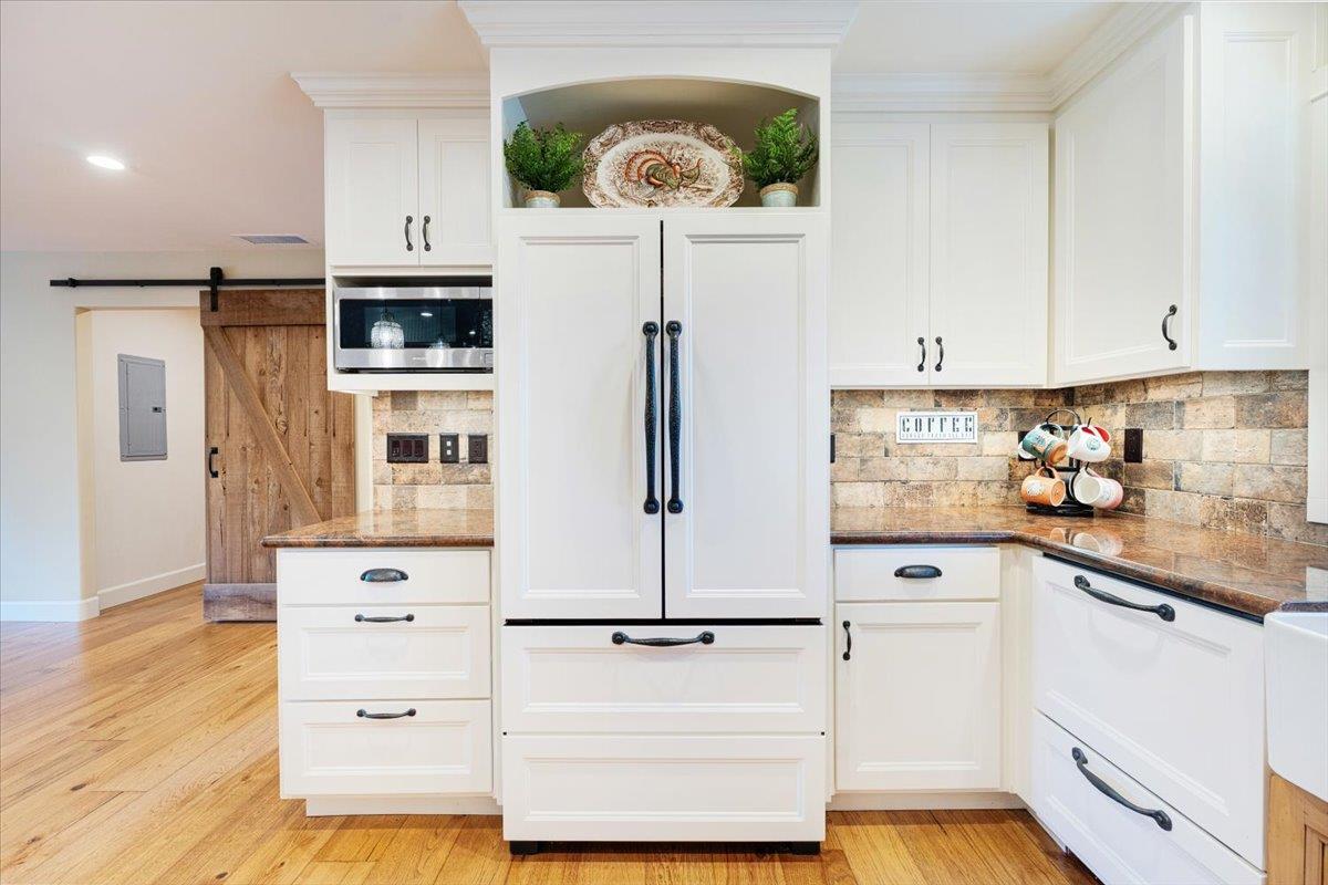 7409 Hihn Road Ben Lomond, CA 95005 - Photo 29 of 101 a kitchen with granite countertop white refrigerator and cabinets