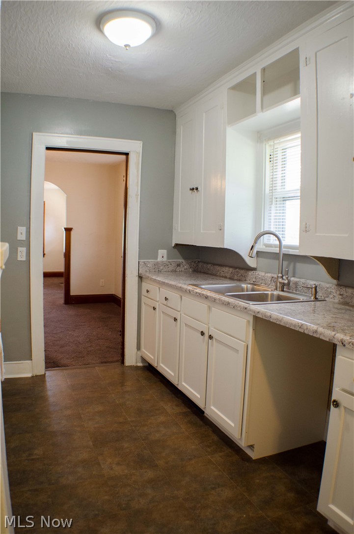 2324 Mogadore Road Akron, OH 44312 - Photo 12 of 26 New lighting, flooring and space for future dishwasher