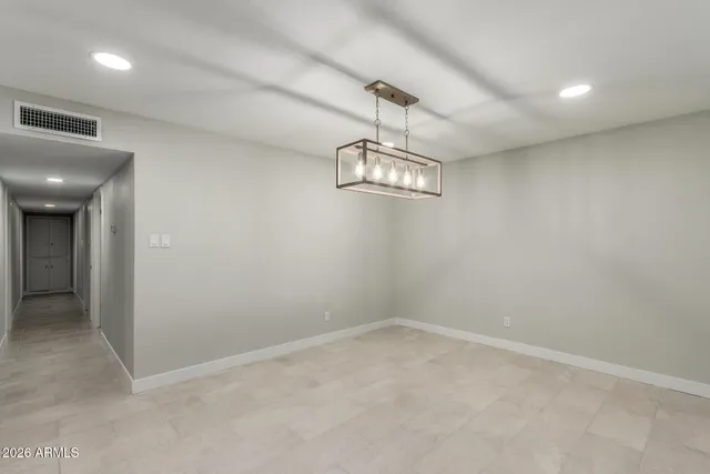 a bathroom with a granite countertop sink mirror and toilet