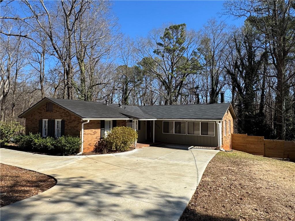 3080 Forrest Park Road Southeast Atlanta, GA 30354 - Photo 1 of 17 a front view of a house with a yard