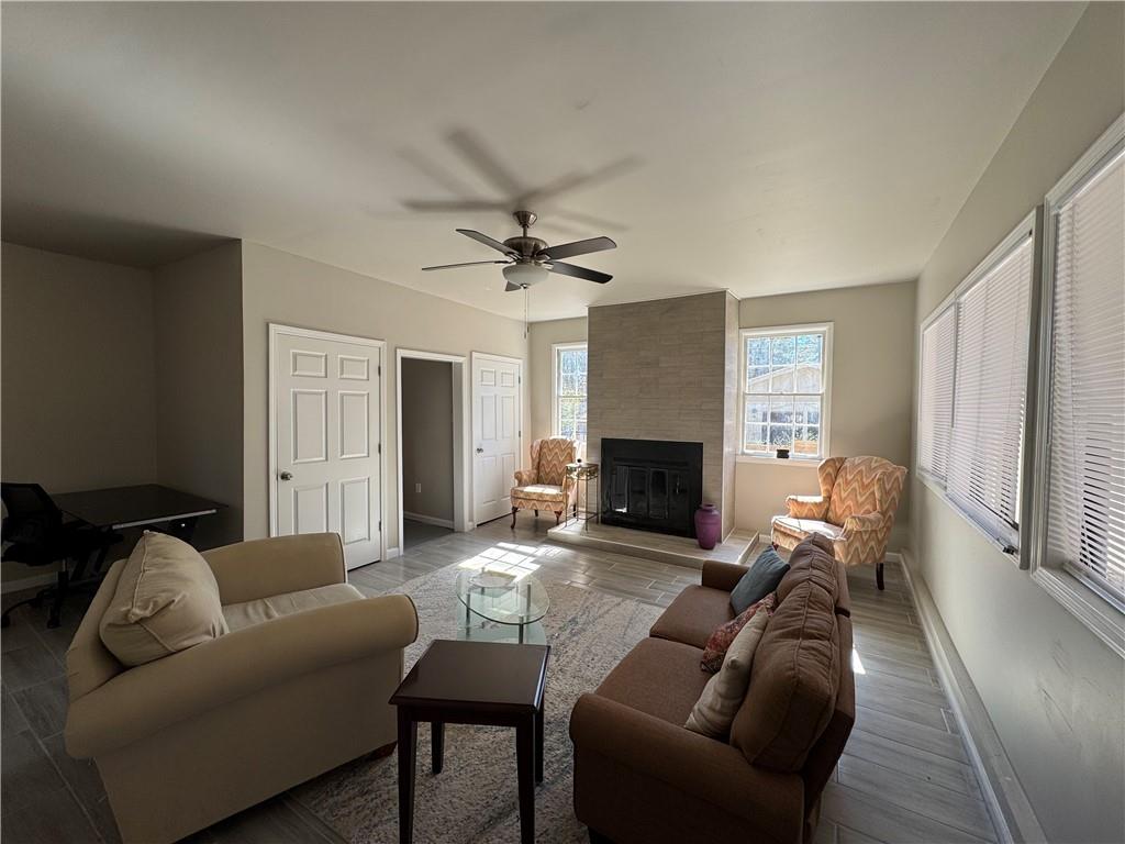 3080 Forrest Park Road Southeast Atlanta, GA 30354 - Photo 12 of 17 a living room with furniture and a fireplace