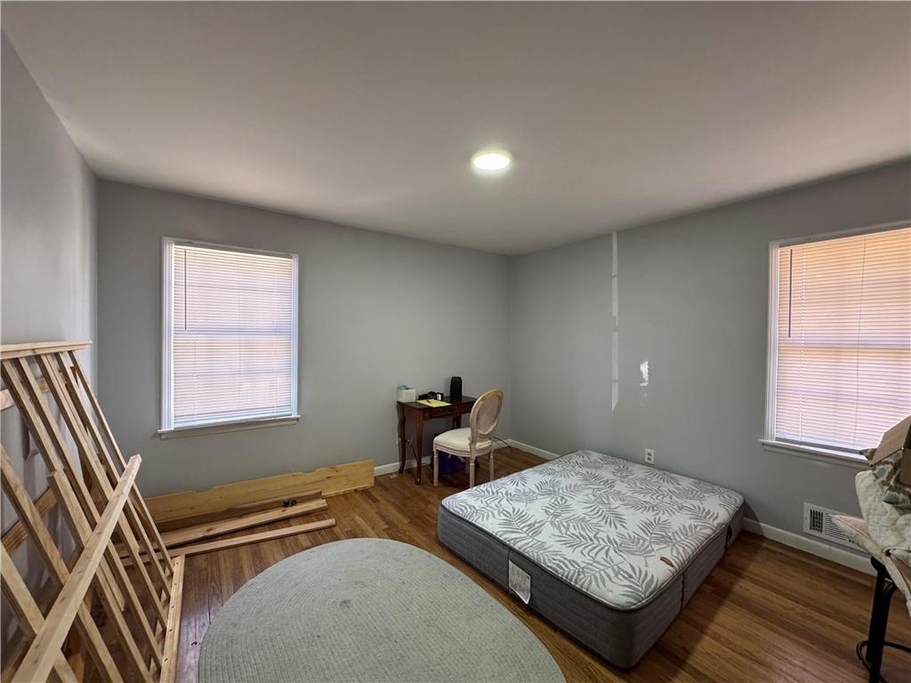 3080 Forrest Park Road Southeast Atlanta, GA 30354 - Photo 14 of 17 a bedroom with two beds and a window