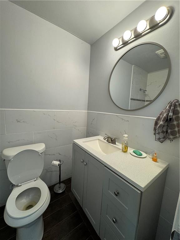 3080 Forrest Park Road Southeast Atlanta, GA 30354 - Photo 15 of 17 a bathroom with a toilet a sink and mirror
