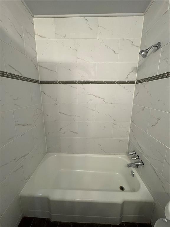 3080 Forrest Park Road Southeast Atlanta, GA 30354 - Photo 16 of 17 a bathroom with a shower and a bath tub