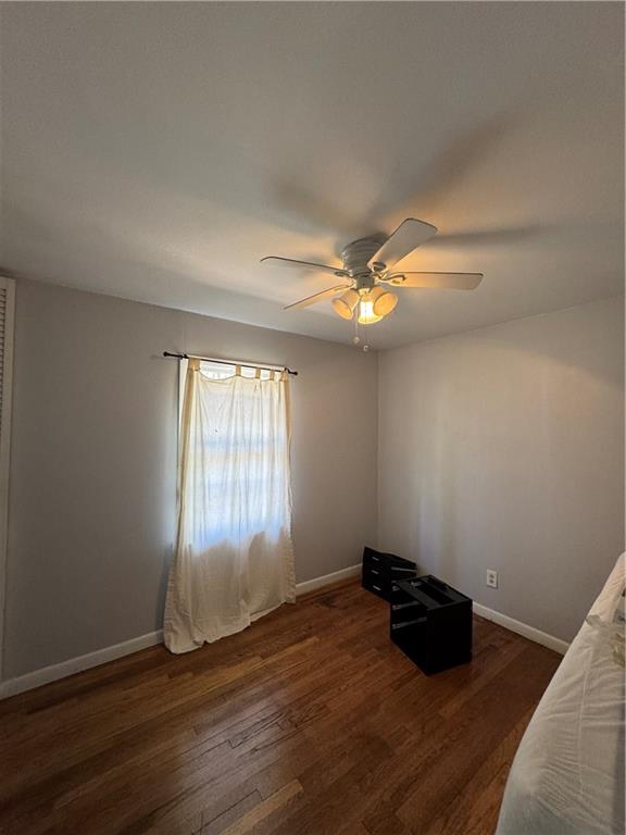 3080 Forrest Park Road Southeast Atlanta, GA 30354 - Photo 17 of 17 a view of an empty room with wooden floor and a window