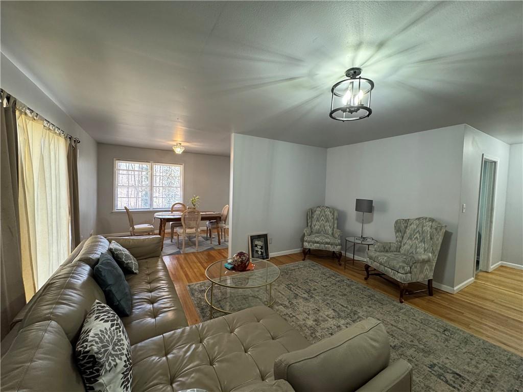 3080 Forrest Park Road Southeast Atlanta, GA 30354 - Photo 5 of 17 a living room with furniture and a large window