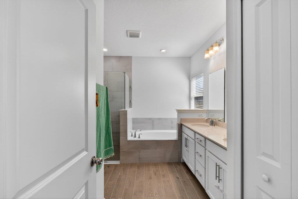 210 White Rabbit Run St. Augustine, FL 32092 - Photo 52 of 85 a bathroom with a double vanity sink and mirror