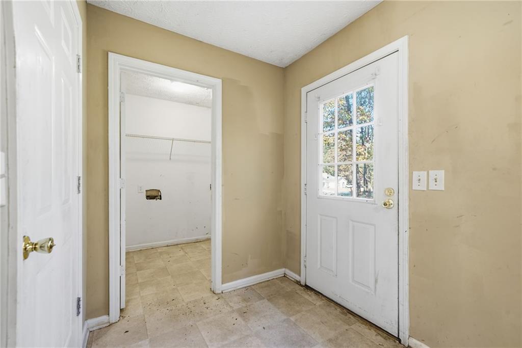 255 Countryside Lane Covington, GA 30016 - Photo 17 of 35 an empty room with windows and closet
