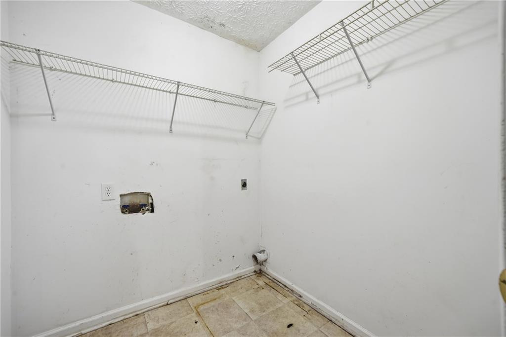 255 Countryside Lane Covington, GA 30016 - Photo 18 of 35 a bathroom with a shower and cabinets