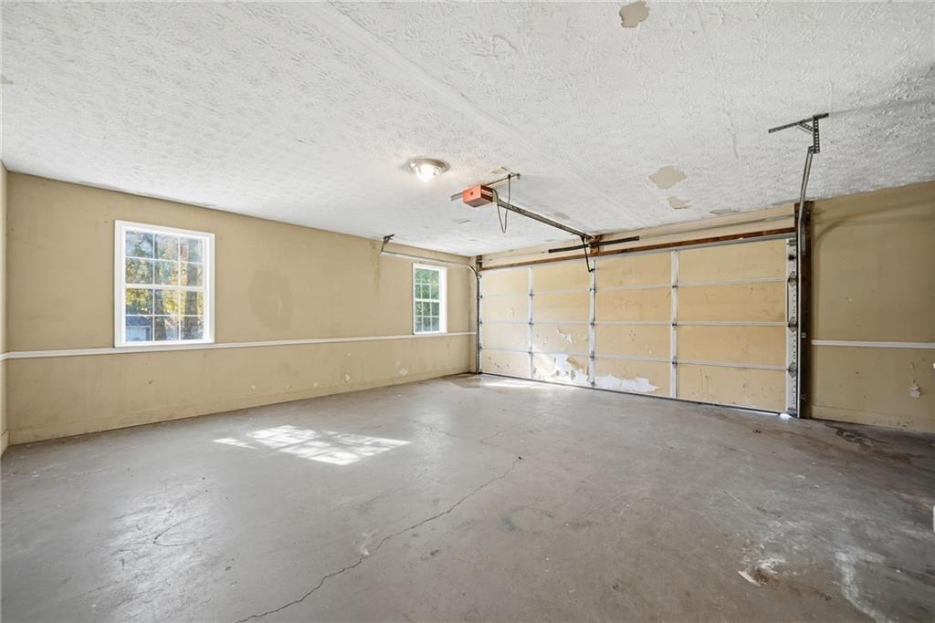 255 Countryside Lane Covington, GA 30016 - Photo 26 of 35 an empty room with windows