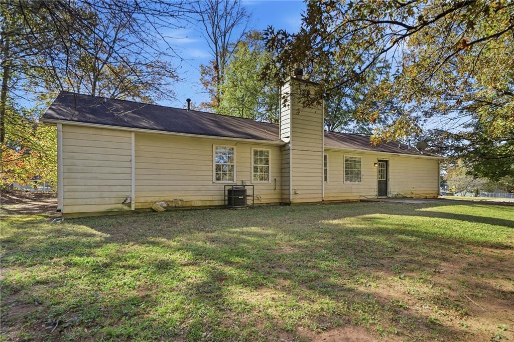 255 Countryside Lane Covington, GA 30016 - Photo 30 of 35 a view of a backyard with a garden