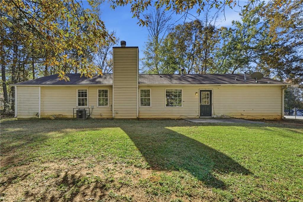 255 Countryside Lane Covington, GA 30016 - Photo 31 of 35 front view of a house with a yard