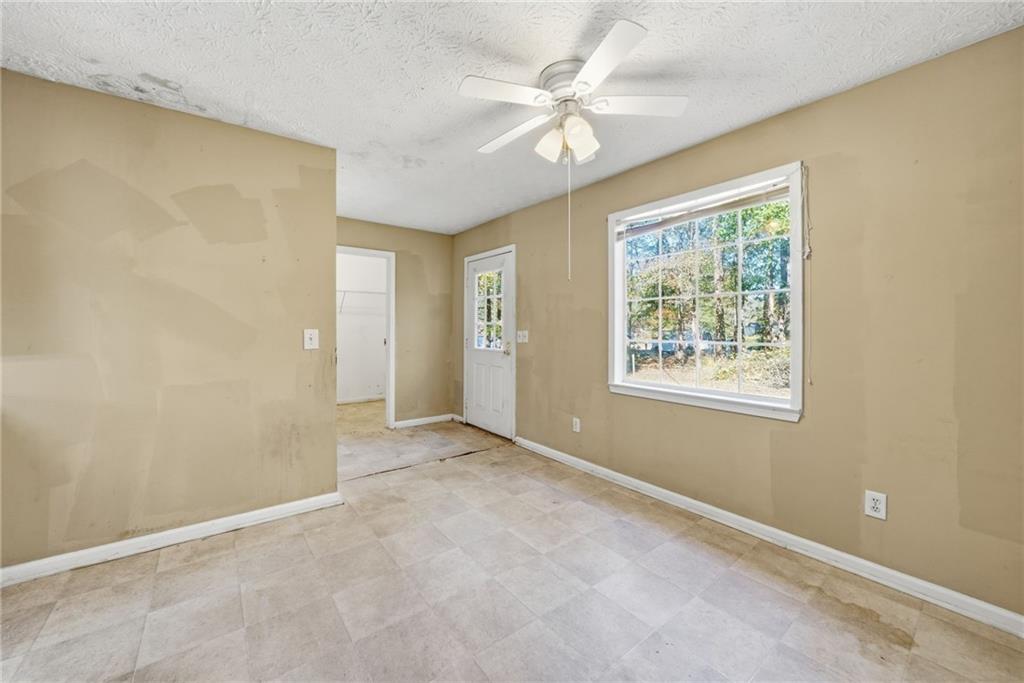 255 Countryside Lane Covington, GA 30016 - Photo 9 of 35 an empty room with windows and closet