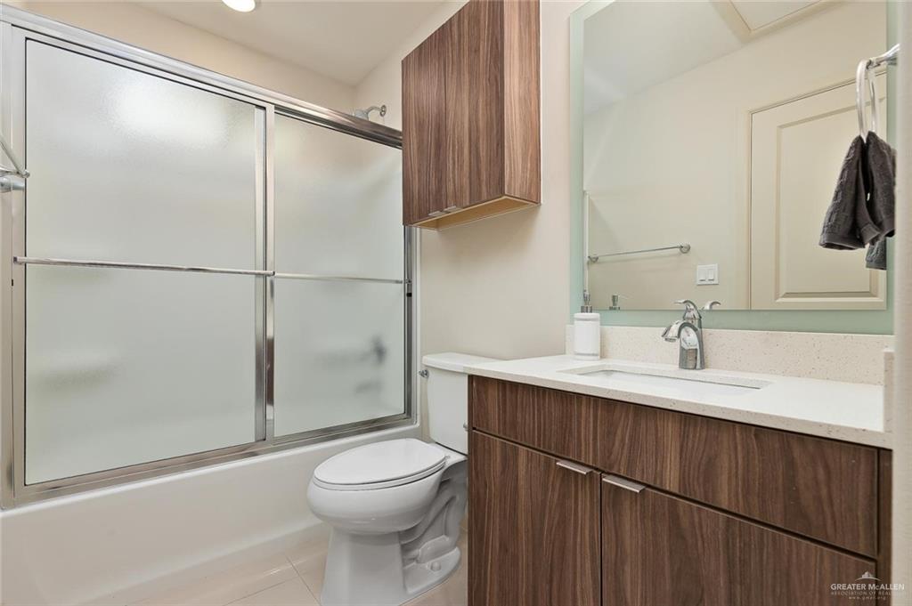 1507 Coyote Hills, Unit 4 Edinburg, TX 78541 - Photo 12 of 12 a bathroom with a sink a toilet and shower