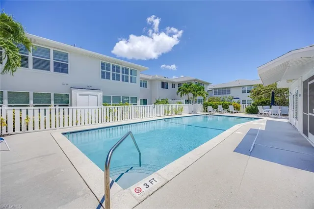 a view of a swimming pool with a deck